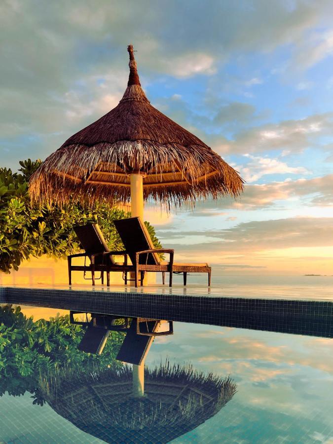 มลาฮินี กูดา บันดอส รีสอร์ต Hotel ฮุลฮูมาเล ภายนอก รูปภาพ Sunset at the beach